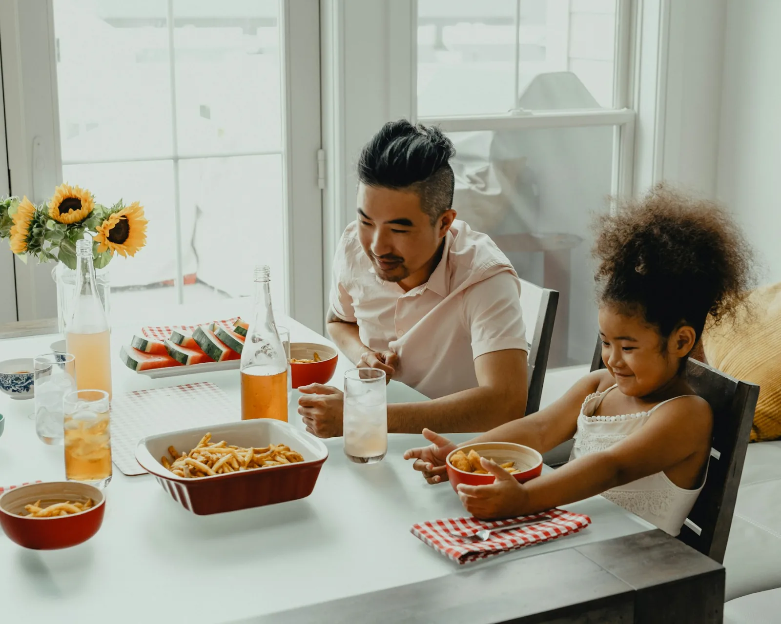 Children and family sharing a meal together