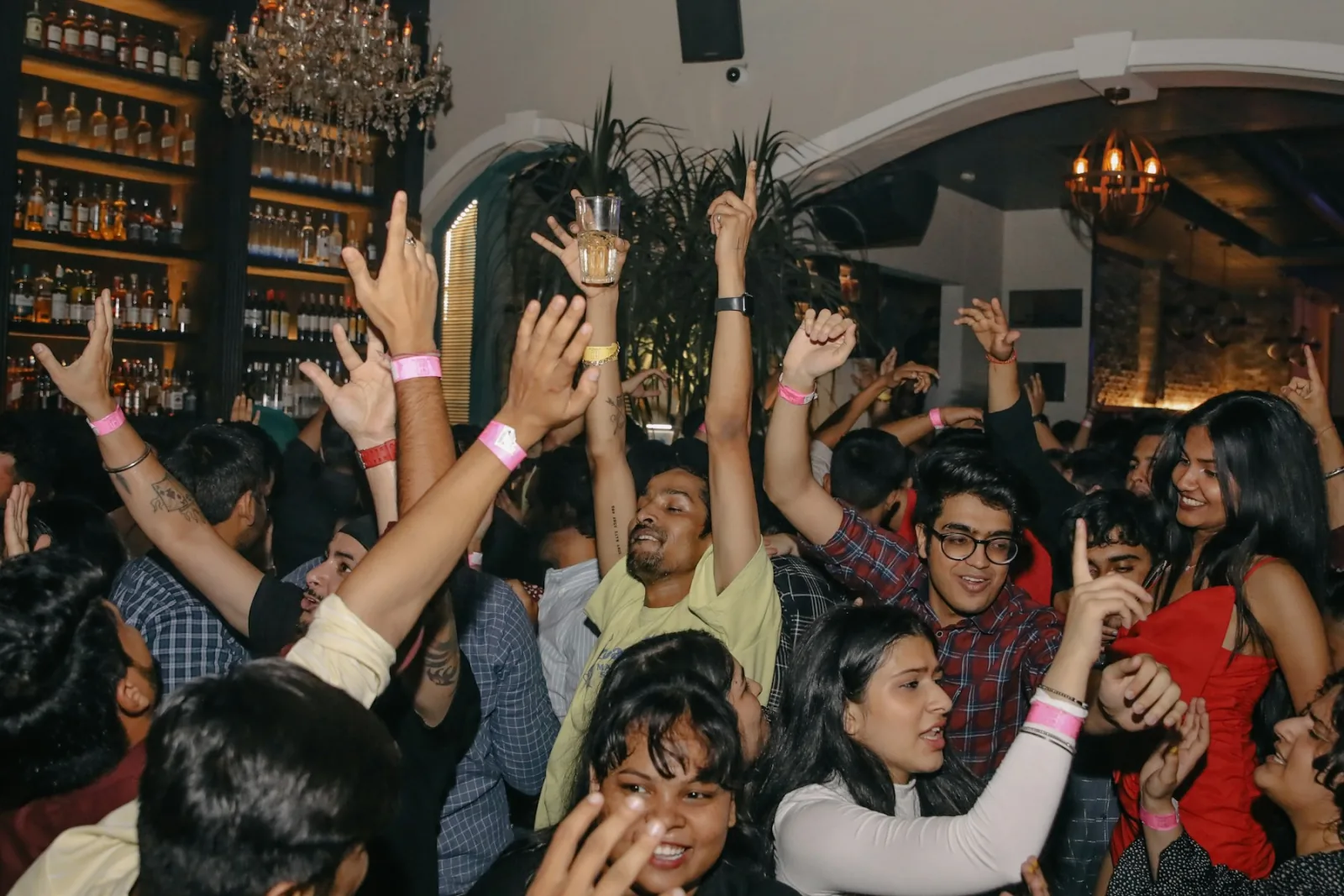 Guests dancing together at a crowded party