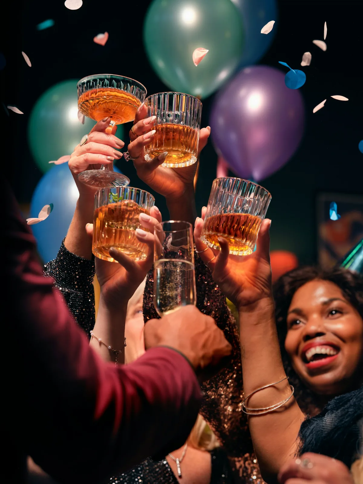Friends raising glasses together at a party