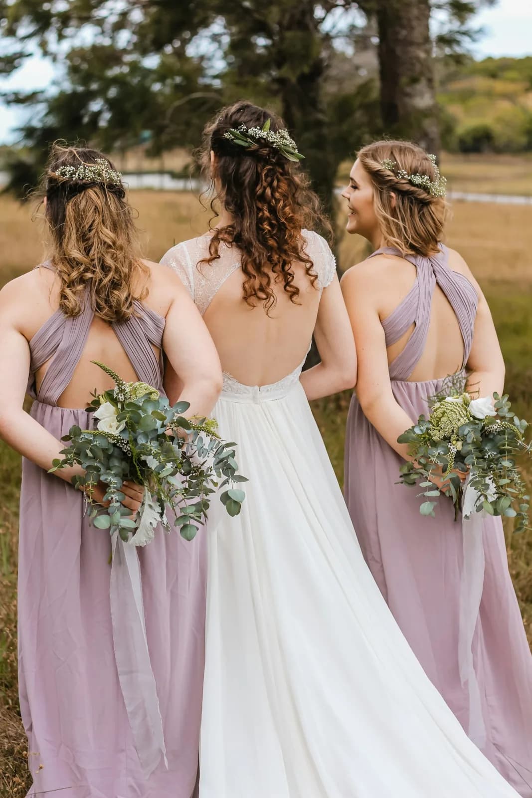 Bridesmaids holding bouquets at a wedding celebration